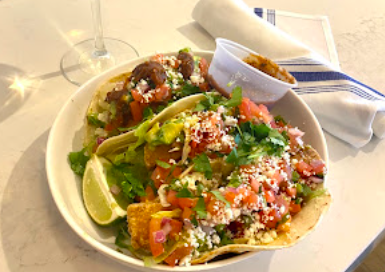 Summer House signature dishes Baja Fish Tacos
Spaghetti Pomodoro
Grilled Surfer-Style Fish